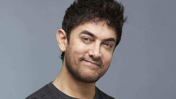 At a Delhi event, Aamir Khan unveiled his new all-grey appearance and announced that he will "not be acting for the next year and a half."