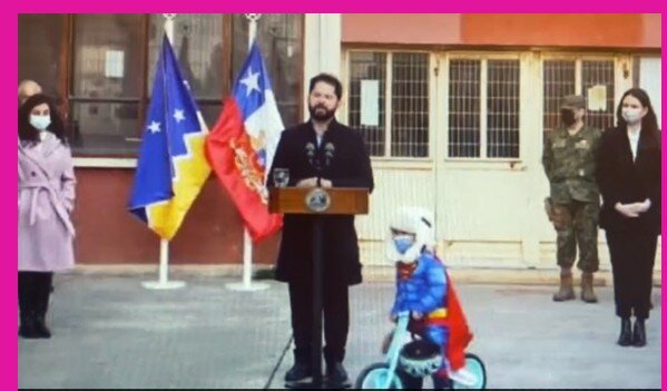 Watch: Trending video of a child cycling around the country's president while he's giving a speech